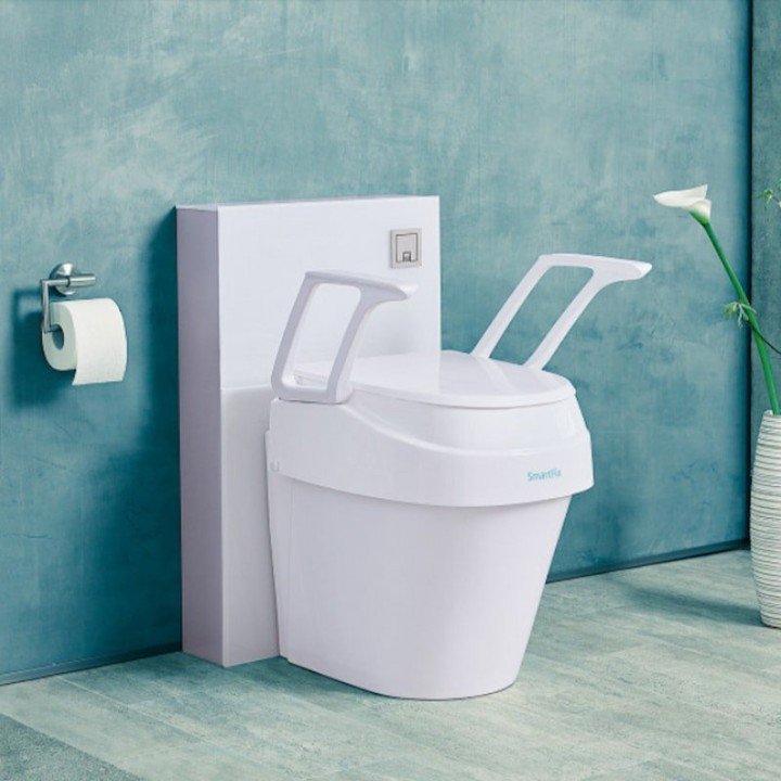 Elevador de w.c. regulable en altura e inclinación con reposabrazos