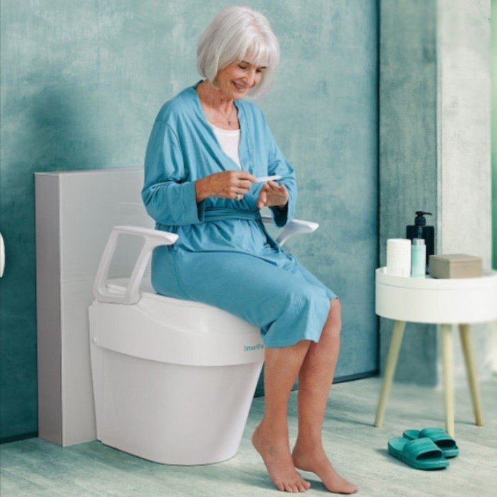 Elevador de w.c. regulable en altura e inclinación con reposabrazos